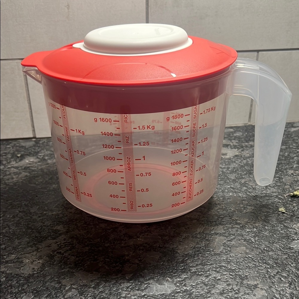 Tupperware Mix n Store Red and White Measuring cup. New without tags